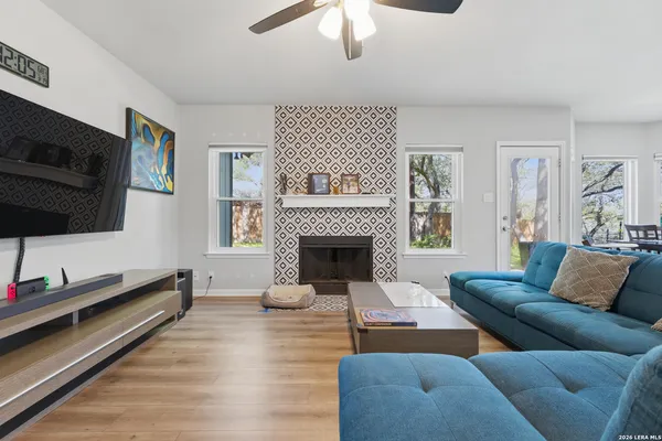 a living room with furniture and a flat screen tv