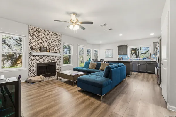 a living room with furniture and a fireplace