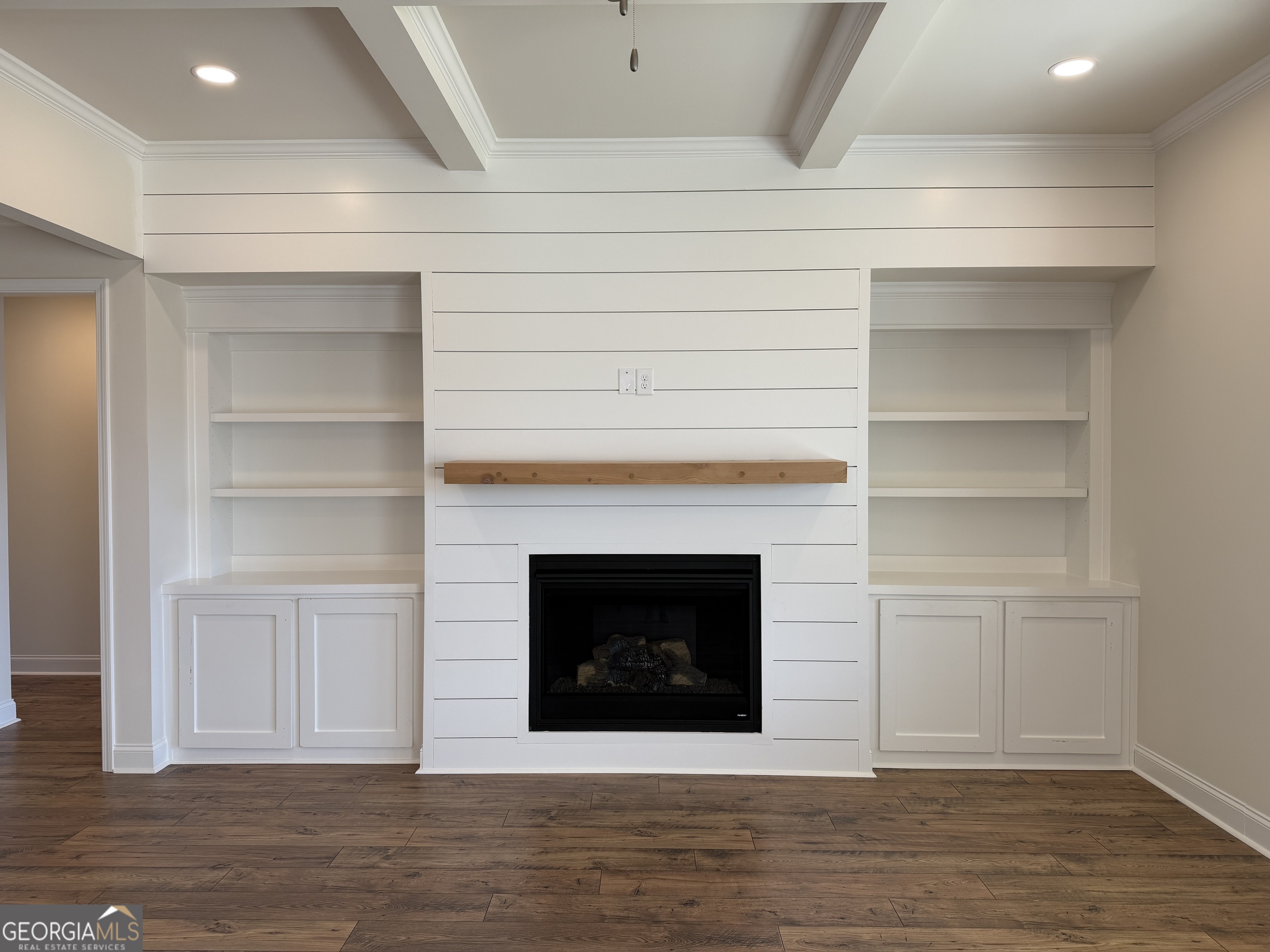 233 Oakdale Road, Unit 53 Jefferson, GA 30549 - Photo 13 of 64 Built ins and a cozy gas fireplace w/ ship lap details and a cedar beam mantle.