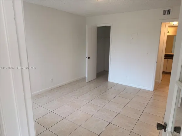 a view of an empty room and utility room