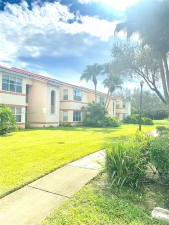 a view of a golf course with a lake