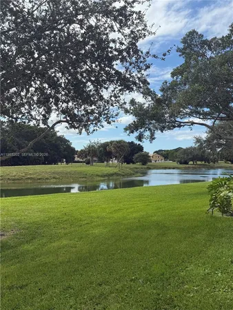 a view of an swimming pool with an outdoor space and seating area