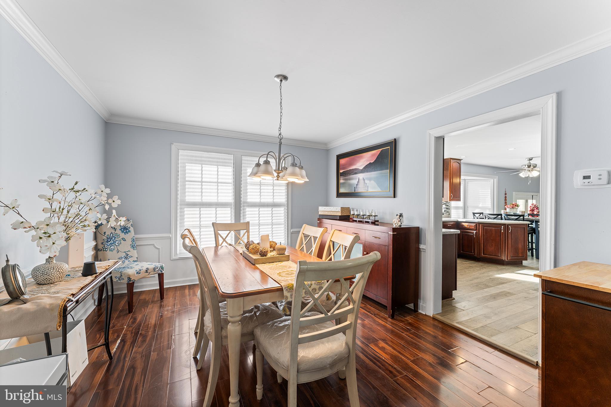 106 Bunning Drive Voorhees, NJ 08043 - Photo 11 of 45 a view of a dining room with furniture window and wooden floor