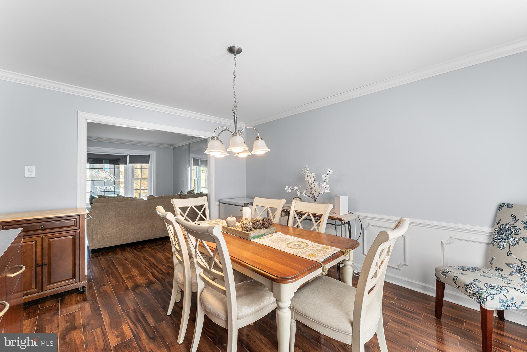 106 Bunning Drive Voorhees, NJ 08043 - Photo 12 of 45 a view of a dining room with furniture wooden floor and chandelier