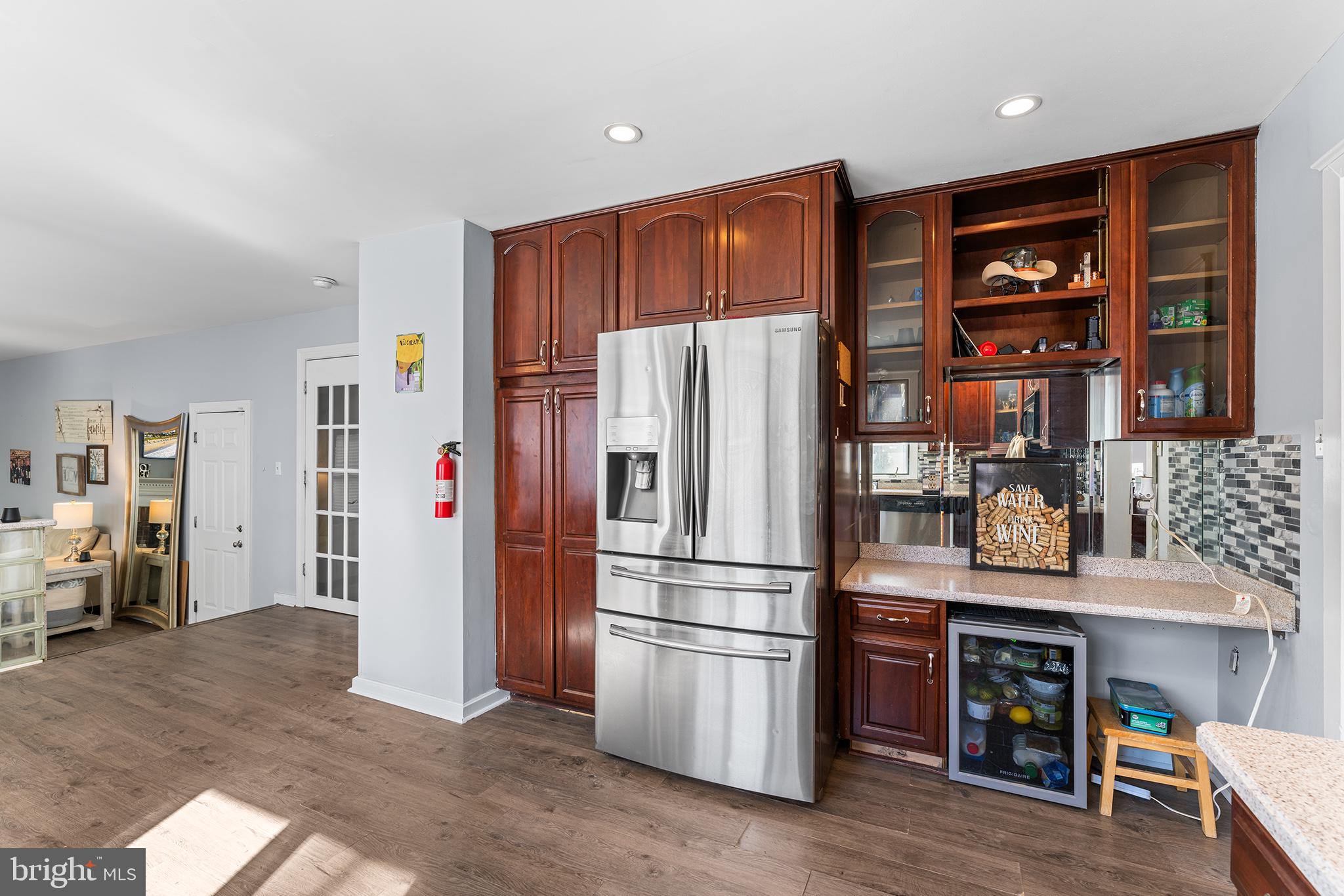 106 Bunning Drive Voorhees, NJ 08043 - Photo 15 of 45 a kitchen with stainless steel appliances granite countertop a refrigerator and a stove top oven