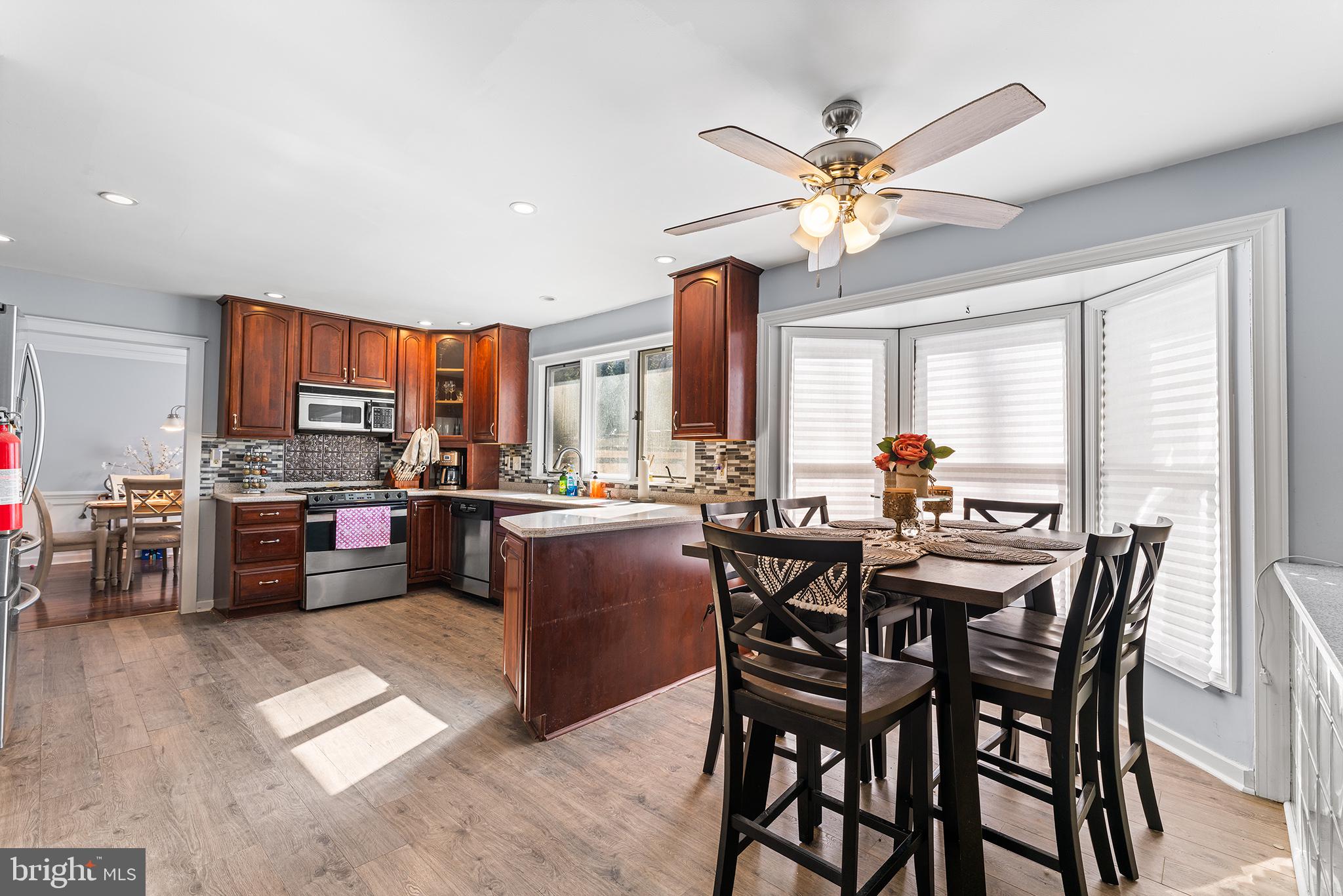 106 Bunning Drive Voorhees, NJ 08043 - Photo 18 of 45 a view of a dining room with furniture and a chandelier