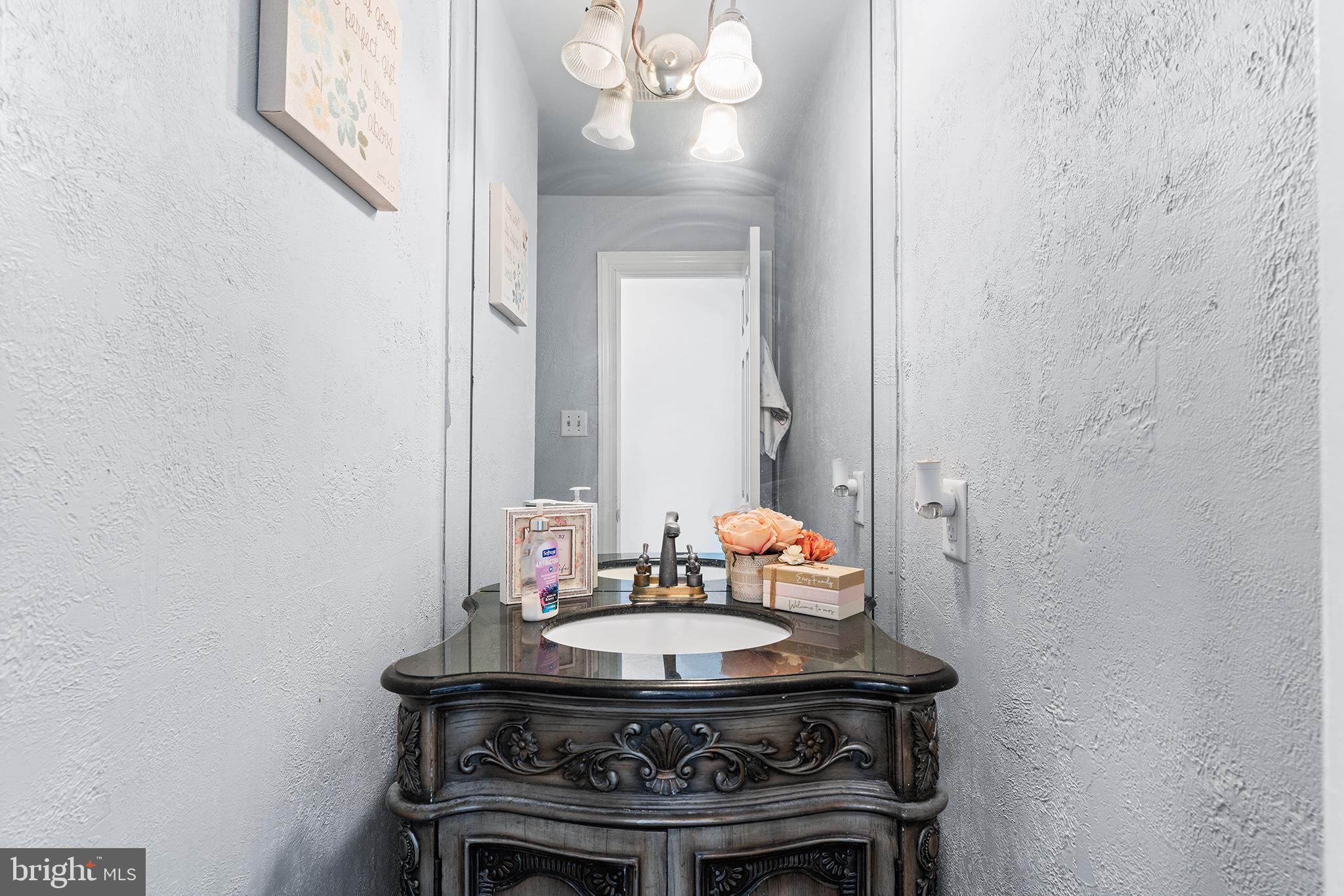 106 Bunning Drive Voorhees, NJ 08043 - Photo 23 of 45 a view of a bathroom with a sink and a mirror