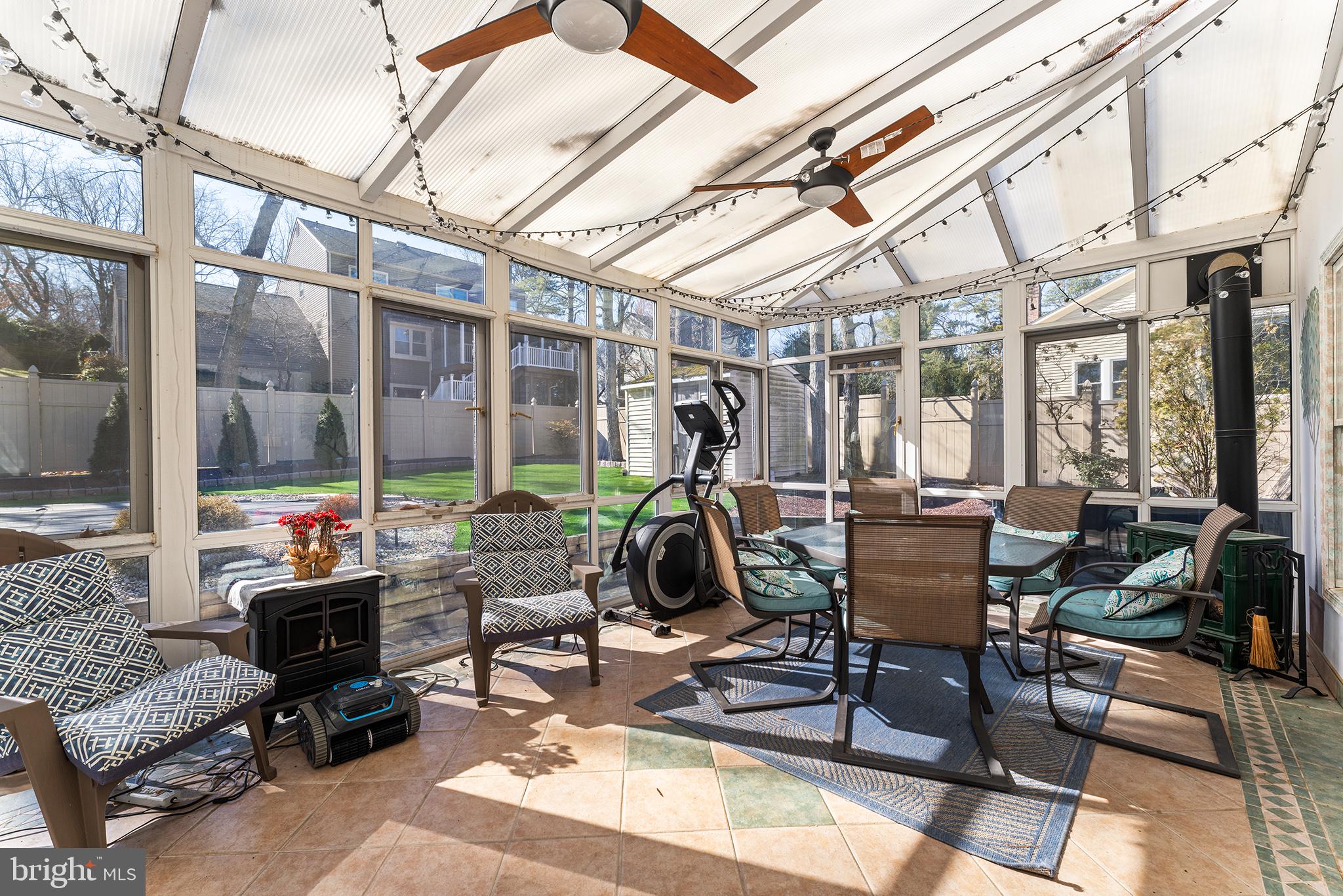 106 Bunning Drive Voorhees, NJ 08043 - Photo 24 of 45 a view of a patio with table and chairs and potted plants