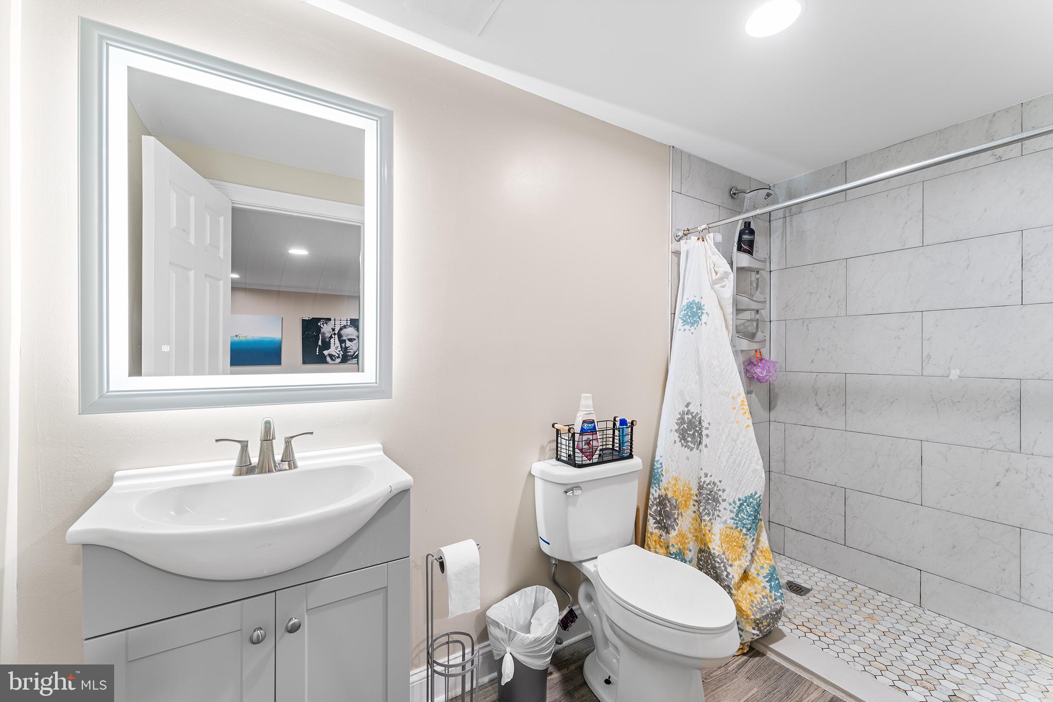 106 Bunning Drive Voorhees, NJ 08043 - Photo 40 of 45 a bathroom with a sink a toilet and shower