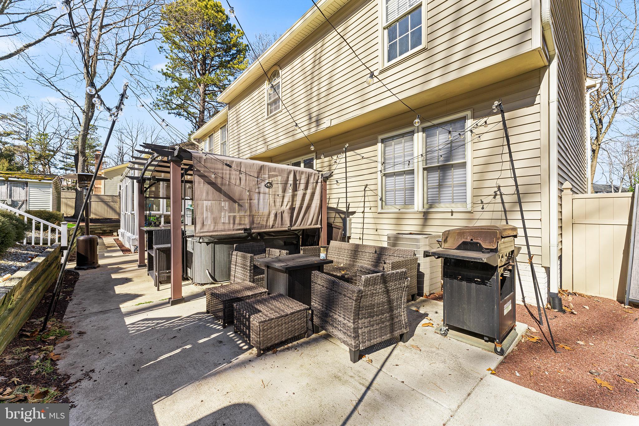106 Bunning Drive Voorhees, NJ 08043 - Photo 42 of 45 a view of a patio with a table and chairs and potted plants