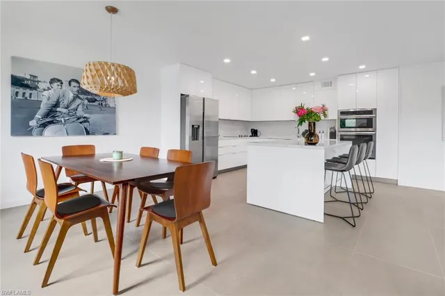 a kitchen with a table and chairs