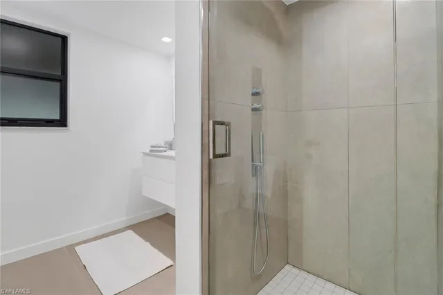 a bathroom with a shower and a sink