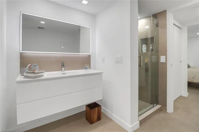 a bathroom with a sink and mirror