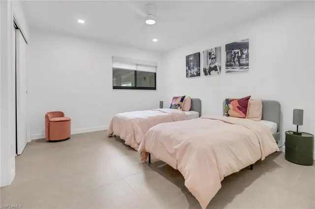 a bedroom with bed and a night stand