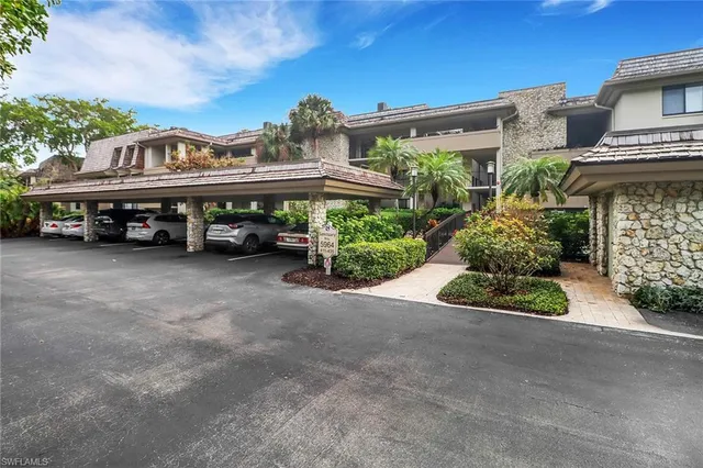 a view of multiple houses with a street