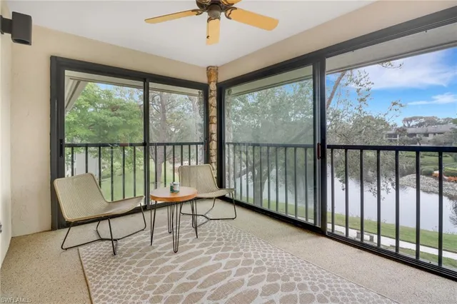 a view of a balcony with chairs