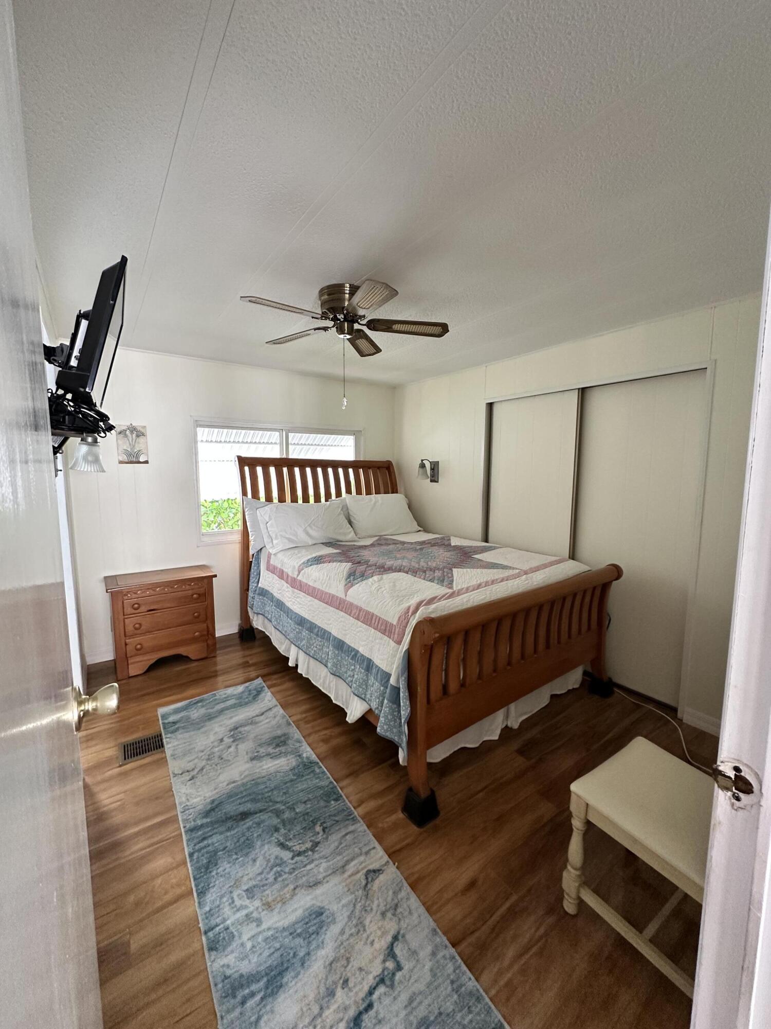 702 North Silver Circle Key Largo, FL 33037 - Photo 14 of 26 a bedroom with a bed a couch and window