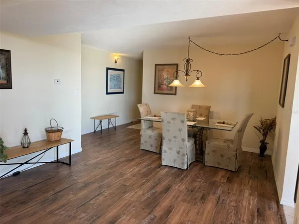 a room with furniture and wooden floor