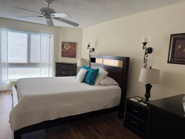 a bedroom with a bed and a dresser