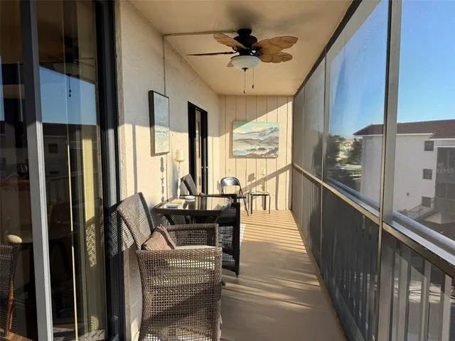 a view of balcony and deck with furniture