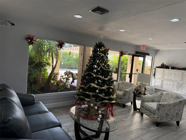 a living room with furniture and a large window