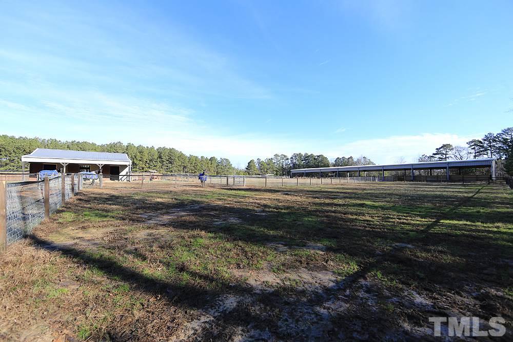 861 Bethlehem Church Road Youngsville, NC 27596 - Photo 20 of 25 a view of a lake with a big yard