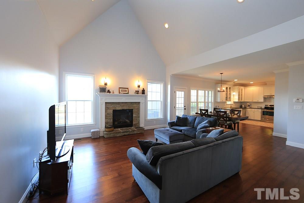 861 Bethlehem Church Road Youngsville, NC 27596 - Photo 3 of 25 a living room with fireplace furniture and a fireplace