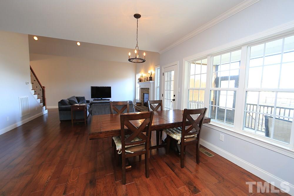 861 Bethlehem Church Road Youngsville, NC 27596 - Photo 6 of 25 a view of a dining room with furniture window and wooden floor