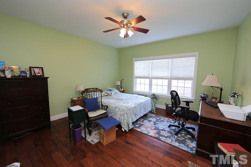 861 Bethlehem Church Road Youngsville, NC 27596 - Photo 7 of 25 a living room with furniture and a window