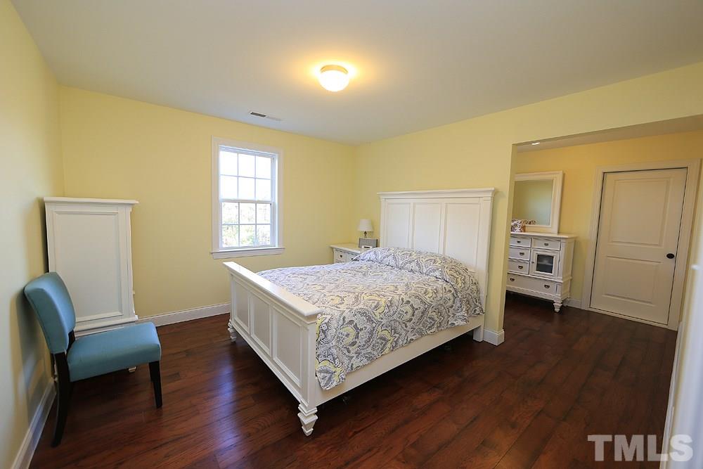 861 Bethlehem Church Road Youngsville, NC 27596 - Photo 10 of 25 a bedroom with a bed and wooden floor