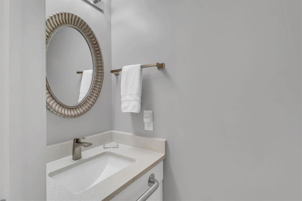 14333 Preston Road, Unit 2103 Dallas, TX 75254 - Photo 14 of 19 a bathroom with a sink and a mirror