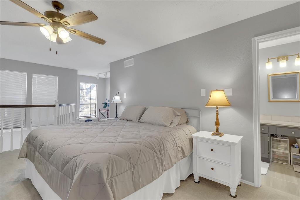 14333 Preston Road, Unit 2103 Dallas, TX 75254 - Photo 19 of 19 a bedroom with a bed and a chandelier