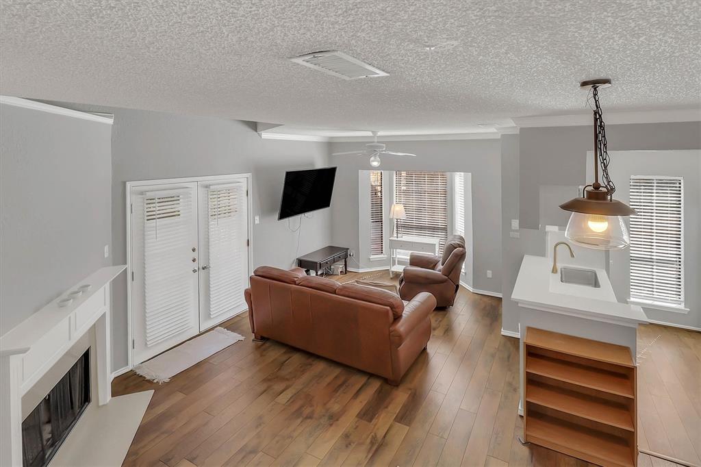 14333 Preston Road, Unit 2103 Dallas, TX 75254 - Photo 5 of 19 a living room with furniture and a flat screen tv