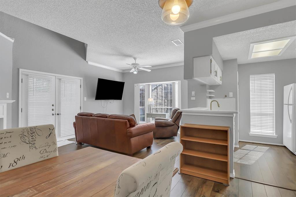 14333 Preston Road, Unit 2103 Dallas, TX 75254 - Photo 6 of 19 a living room with furniture and a flat screen tv