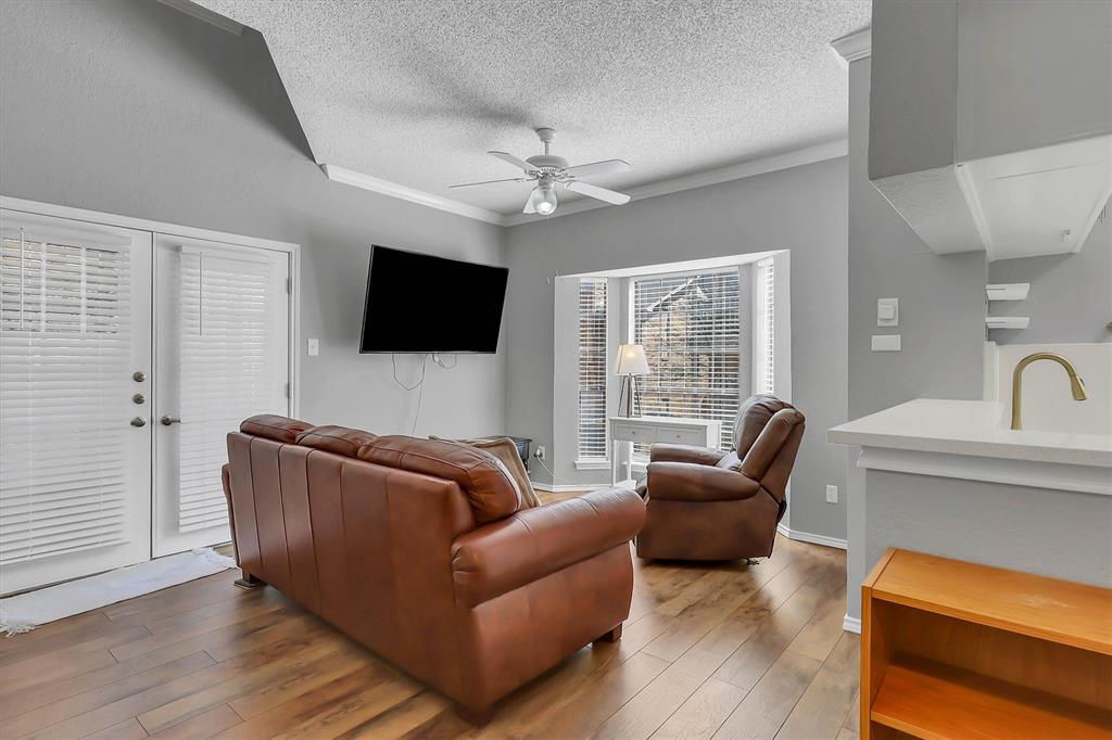 14333 Preston Road, Unit 2103 Dallas, TX 75254 - Photo 7 of 19 a living room with furniture and a flat screen tv