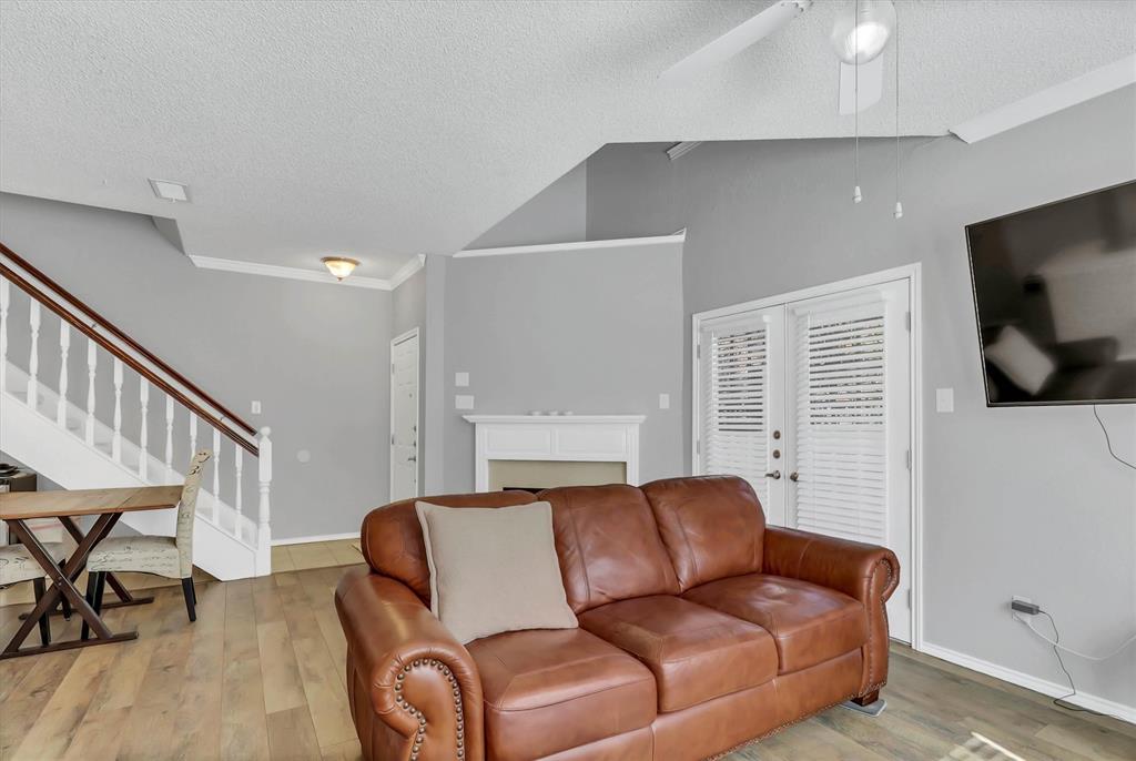 14333 Preston Road, Unit 2103 Dallas, TX 75254 - Photo 8 of 19 a living room with furniture and a flat screen tv