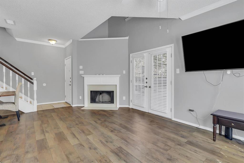 14333 Preston Road, Unit 2103 Dallas, TX 75254 - Photo 9 of 19 a view of a livingroom with an empty space and a fireplace