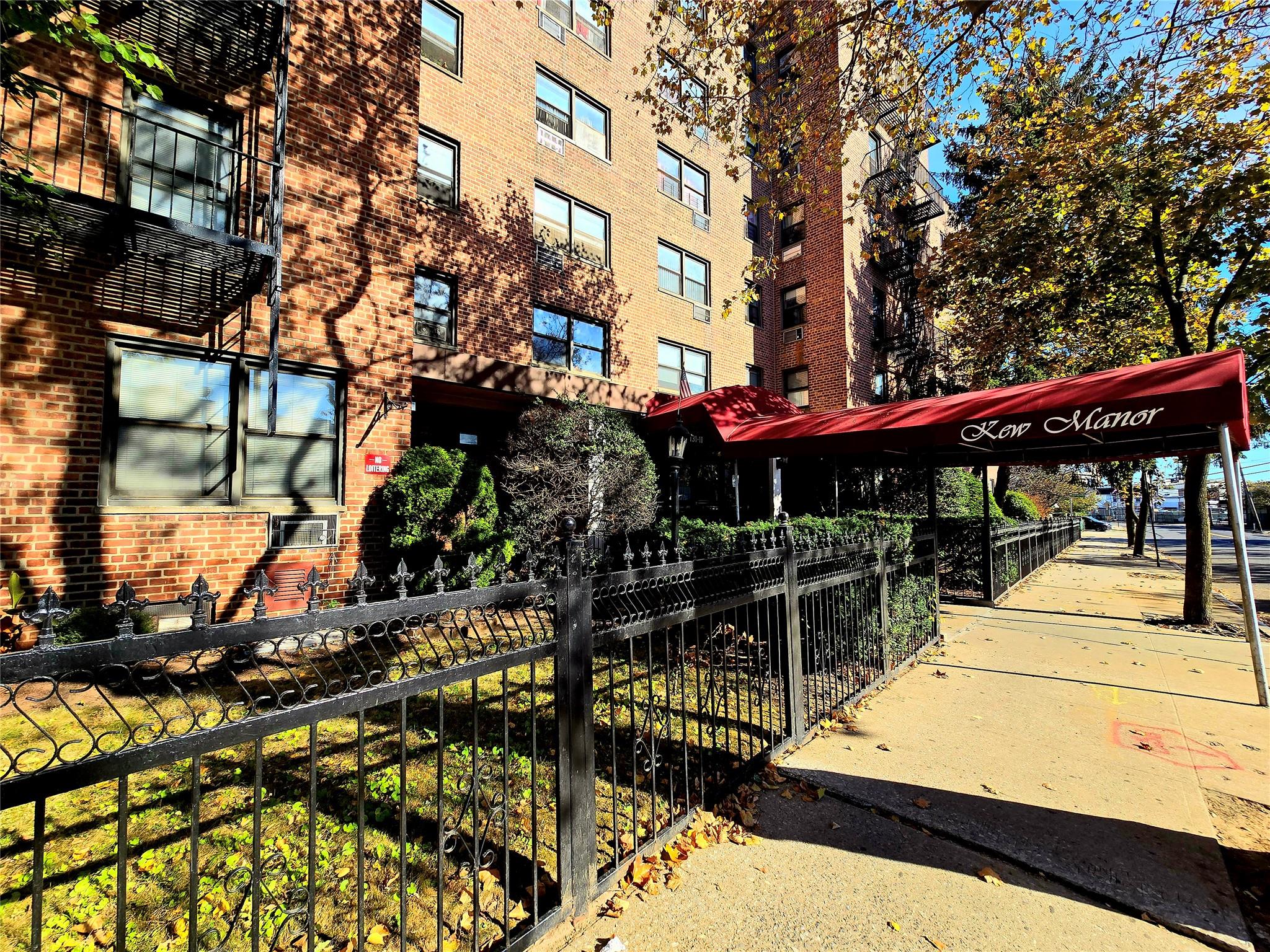131-11 Kew Gardens Road, Unit 5F Queens, NY 11418 - Photo 2 of 9 a view of a building with sitting area