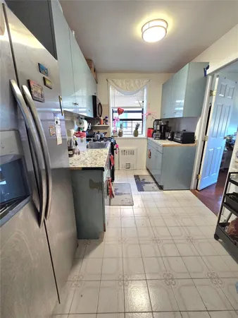 a bathroom with a toilet sink vanity and mirror