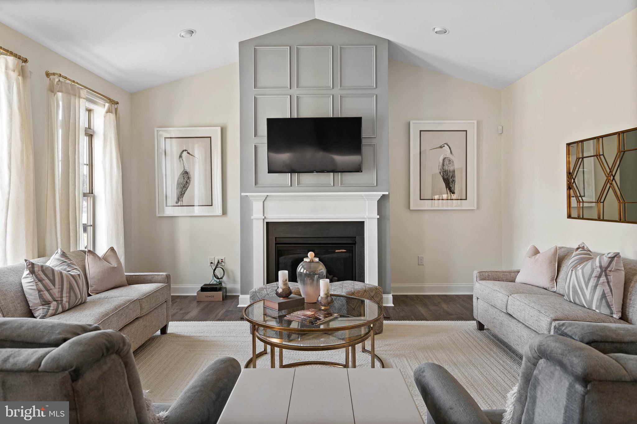 22544 Hummingbird Road Ellendale, DE 19941 - Photo 14 of 32 a living room with furniture fireplace and window