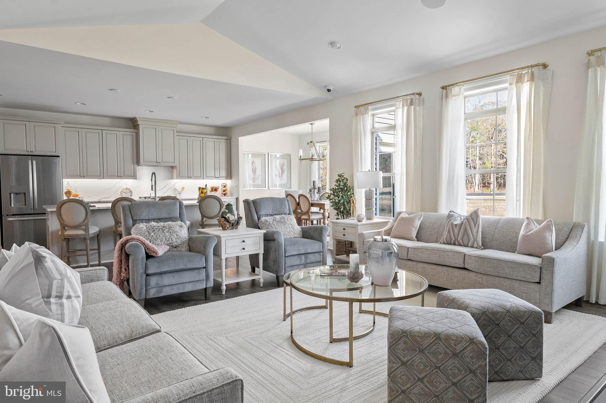 22544 Hummingbird Road Ellendale, DE 19941 - Photo 16 of 32 a living room with furniture large window and glass table