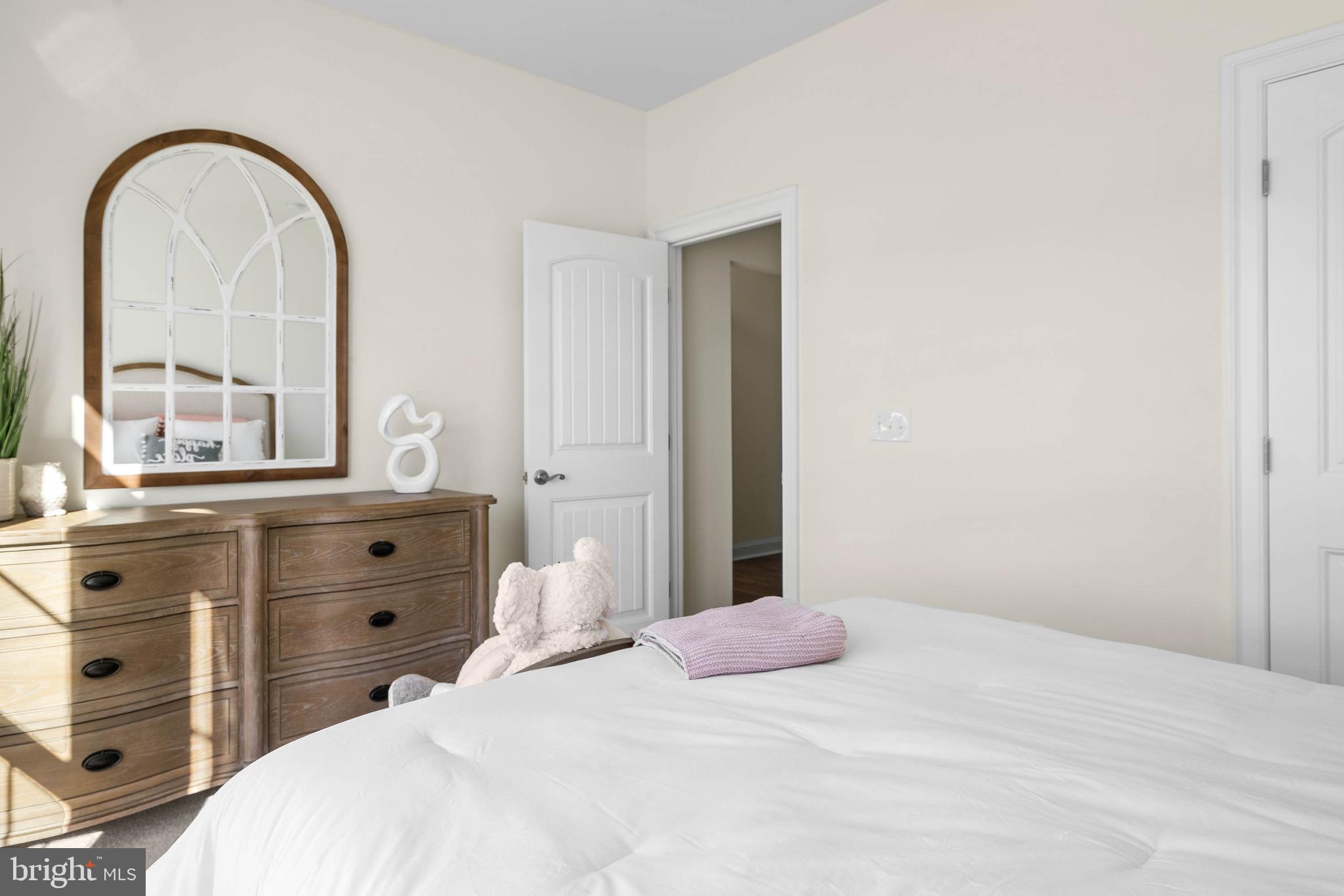 22544 Hummingbird Road Ellendale, DE 19941 - Photo 18 of 32 a bedroom with a bed and a dresser