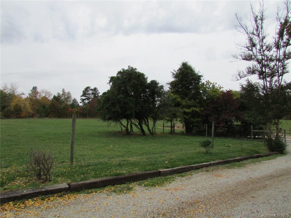 1310 West Ridge Road Salisbury, NC 28147 - Photo 3 of 24 a view of a golf course with a lake