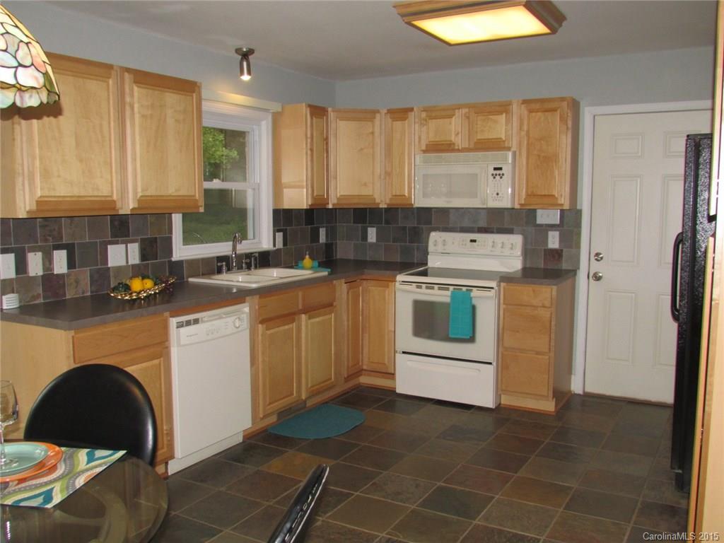 1310 West Ridge Road Salisbury, NC 28147 - Photo 8 of 24 a kitchen with stainless steel appliances a stove a sink and a refrigerator