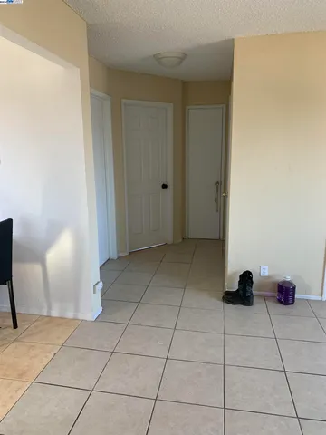 a view of a backyard with wooden fence