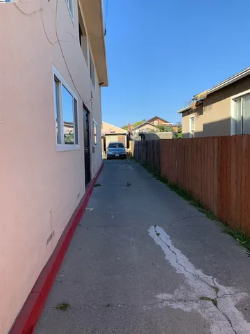 a view of entryway with wooden floor and stairs