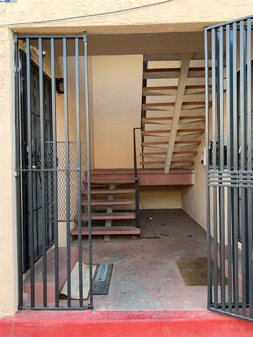 a view of a car parked in front of a house