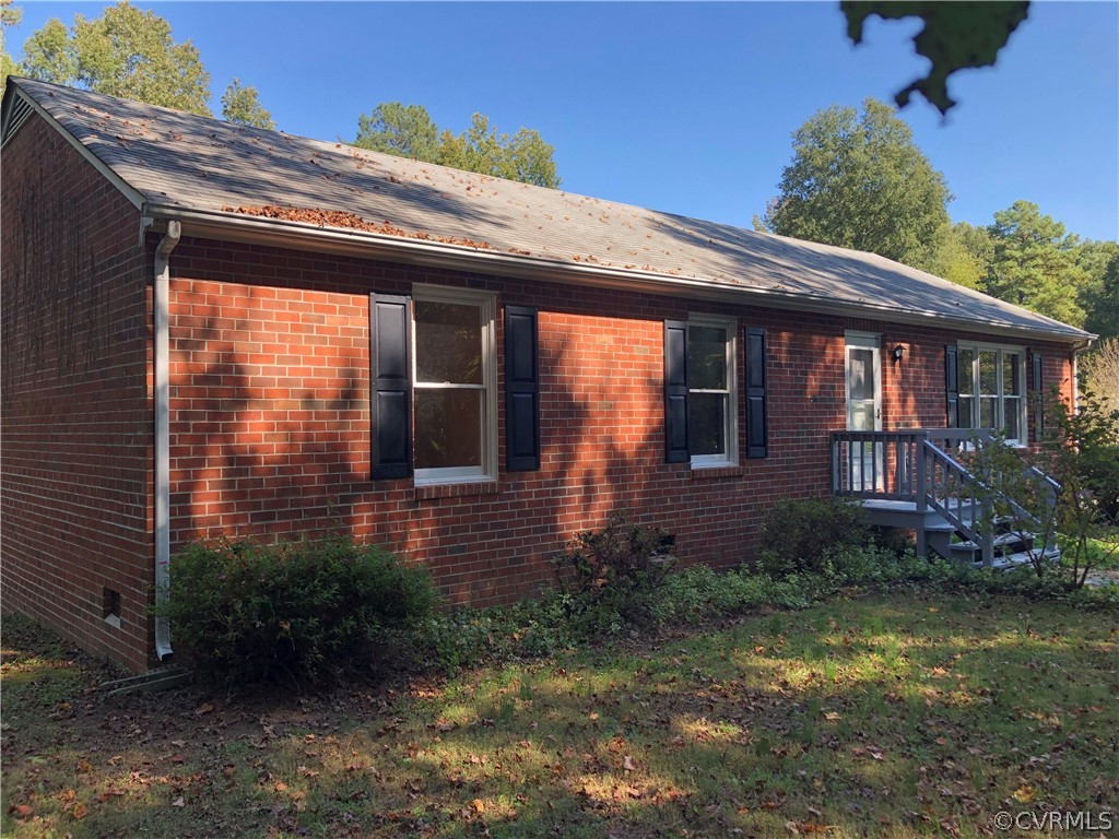 17282 Old Ridge Road Montpelier, VA 23192 - Photo 3 of 35 a view of a house with brick walls and potted plants