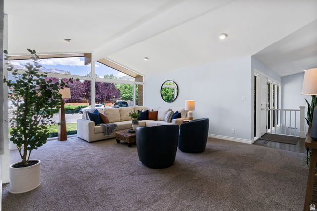 576 East 3950 North Provo, UT 84604 - Photo 12 of 47 Living area with expansive windows and vaulted ceilings