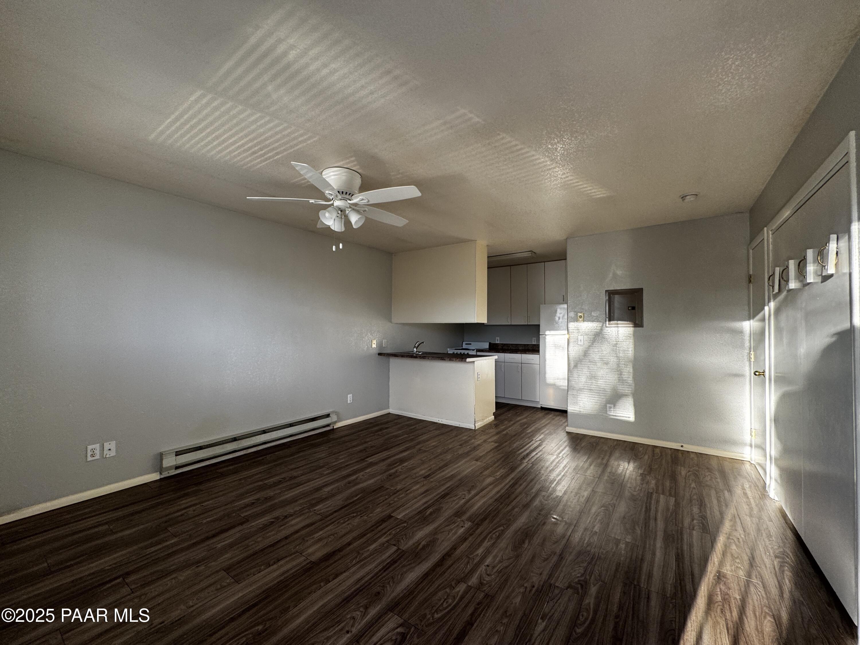 4873 North Judy Court, Unit C Prescott Valley, AZ 86314 - Photo 2 of 6 a view of empty room with wooden floor